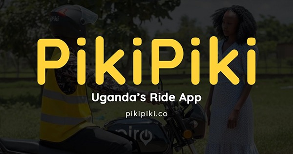 PikiPiki rider wearing a yellow helmet waiting for a passenger near Gulu Main Market